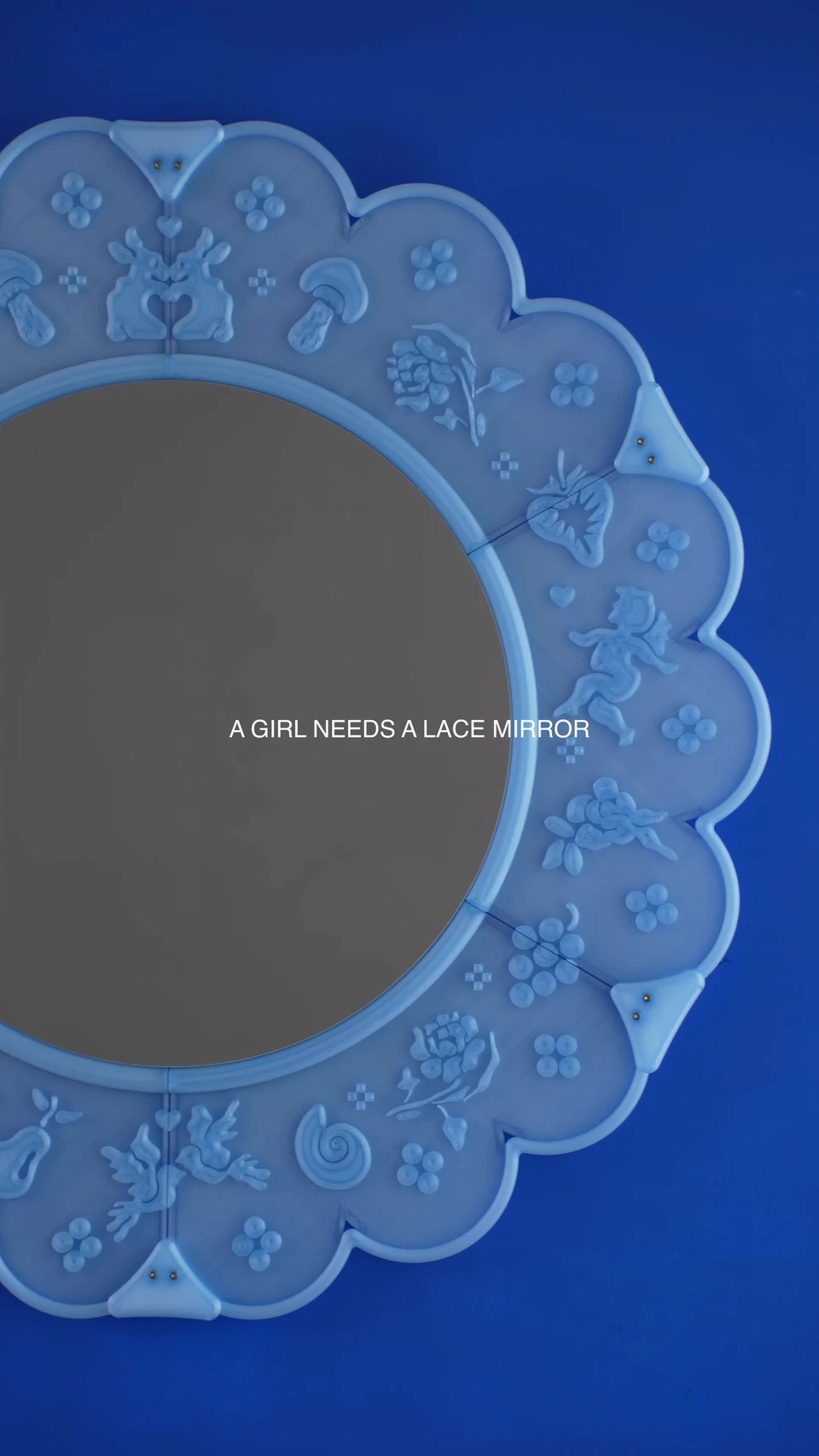 The translucent blue Lace Mirror in use