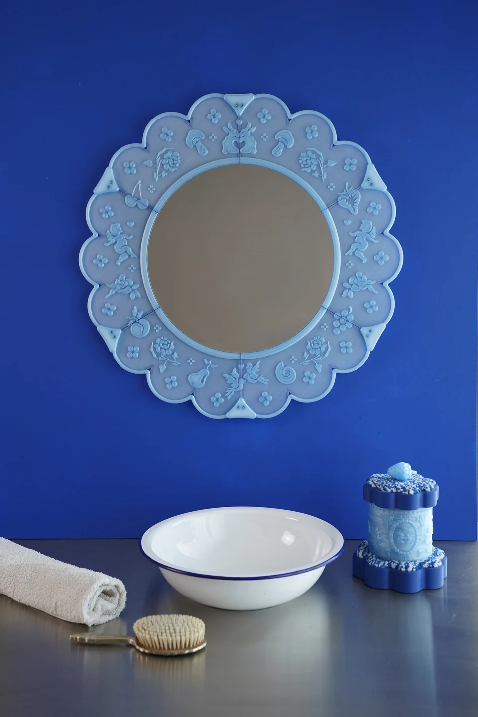 A blue Lace Mirror and Treasure Box in a cobalt blue dressing-table scene.