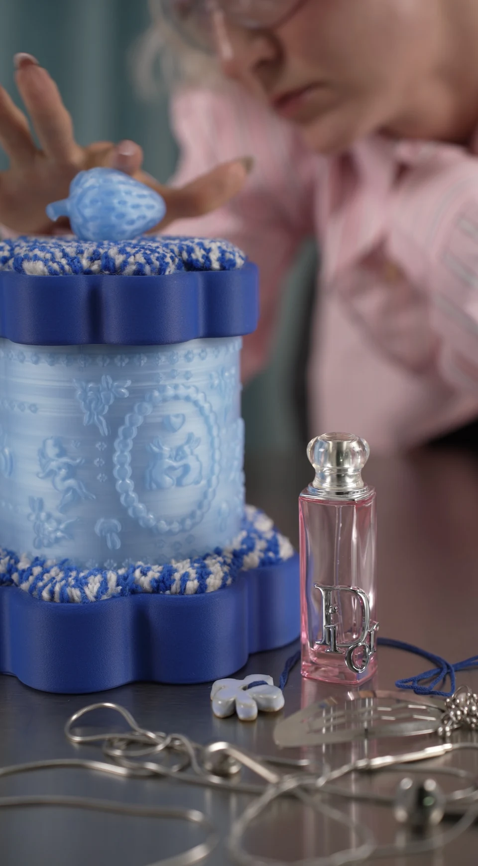 The Treasure Box on a silver dressing table, with Nadia leaning into the scene behind it.